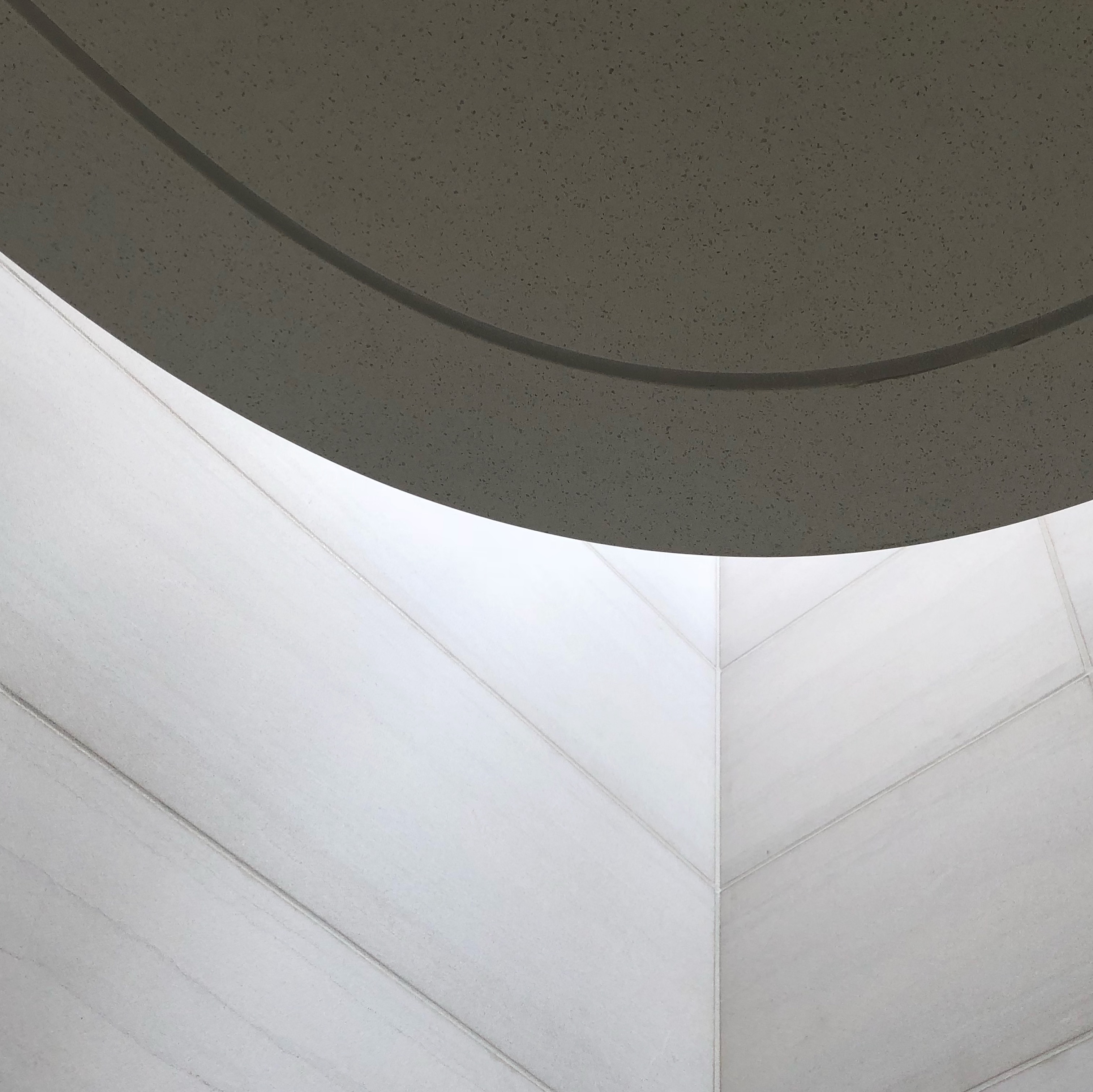 Sculpted stone stair and skylight detail